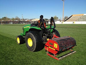 gentleman on machine riding it on field 