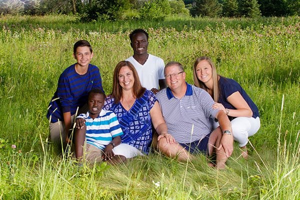 Brent Amann taking a portrait with his family