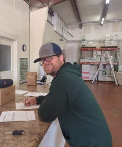 Justin Thompson working at counter