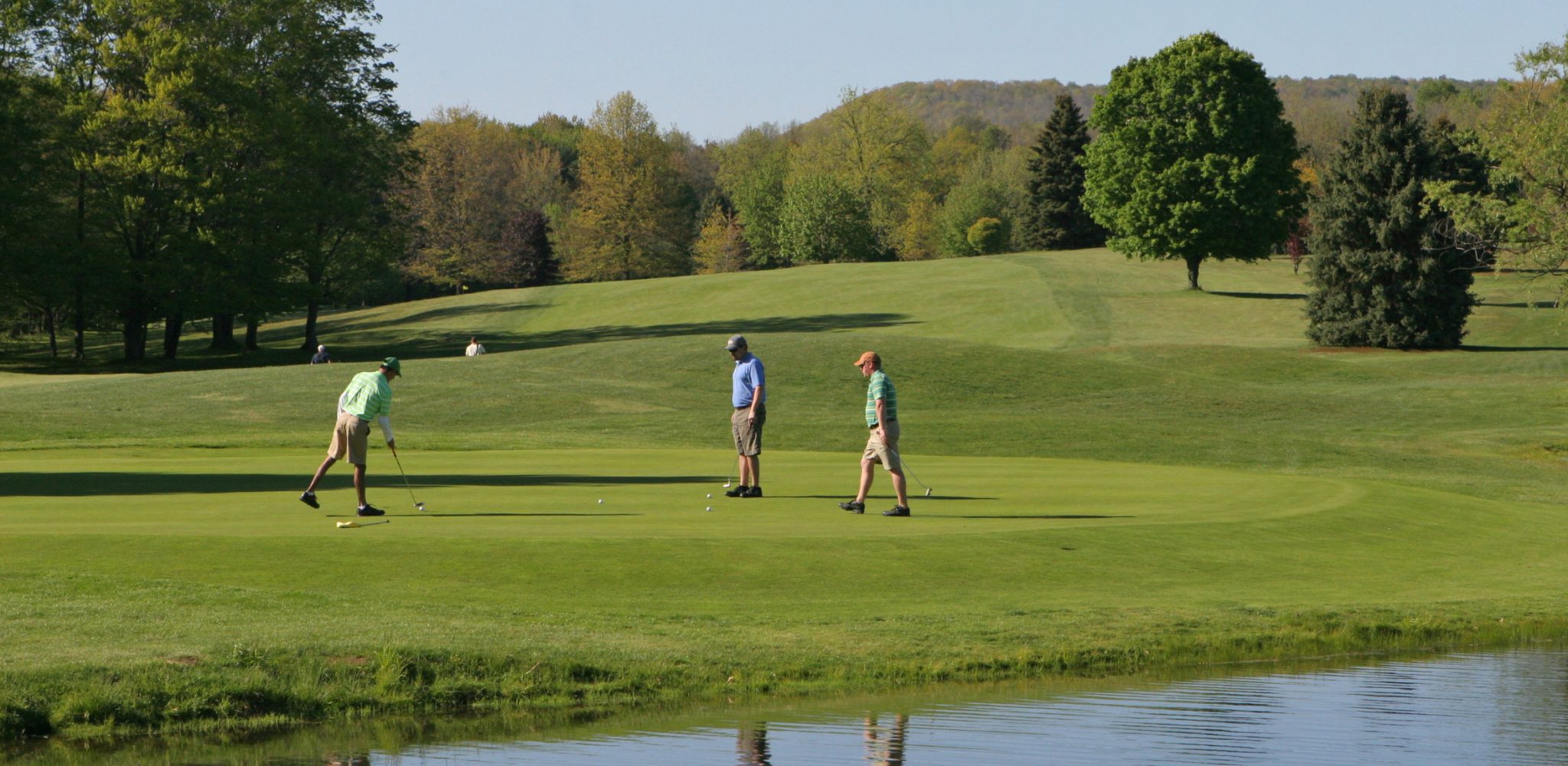 members golfing on a golf course