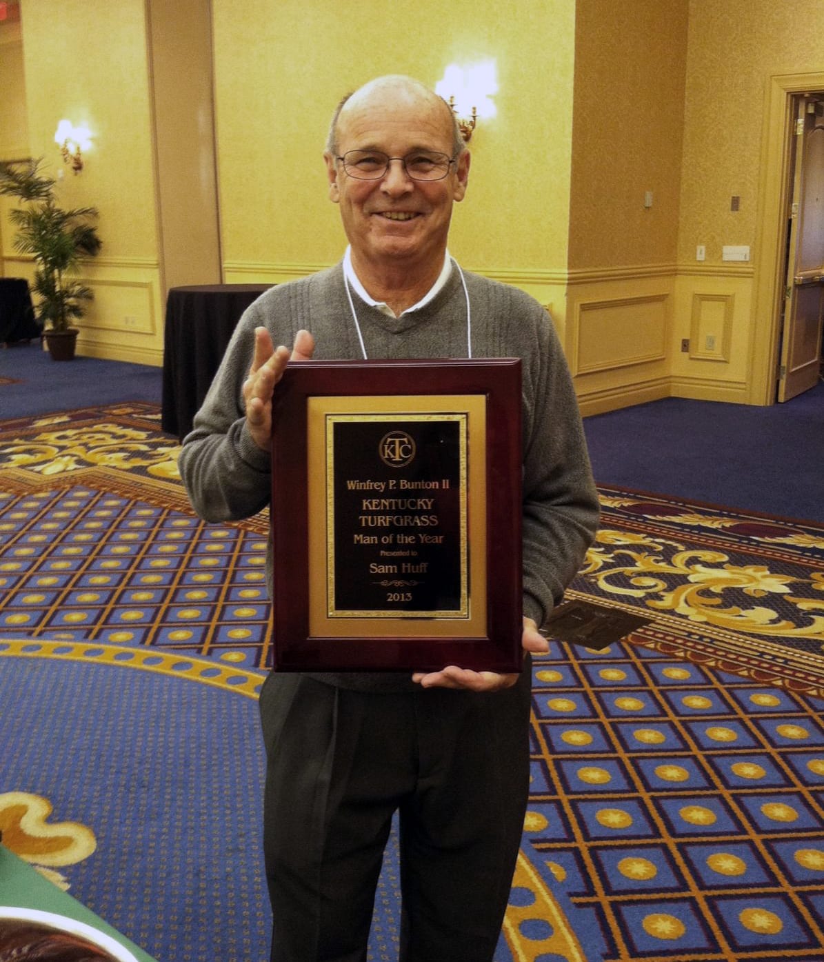 gentleman holding award
